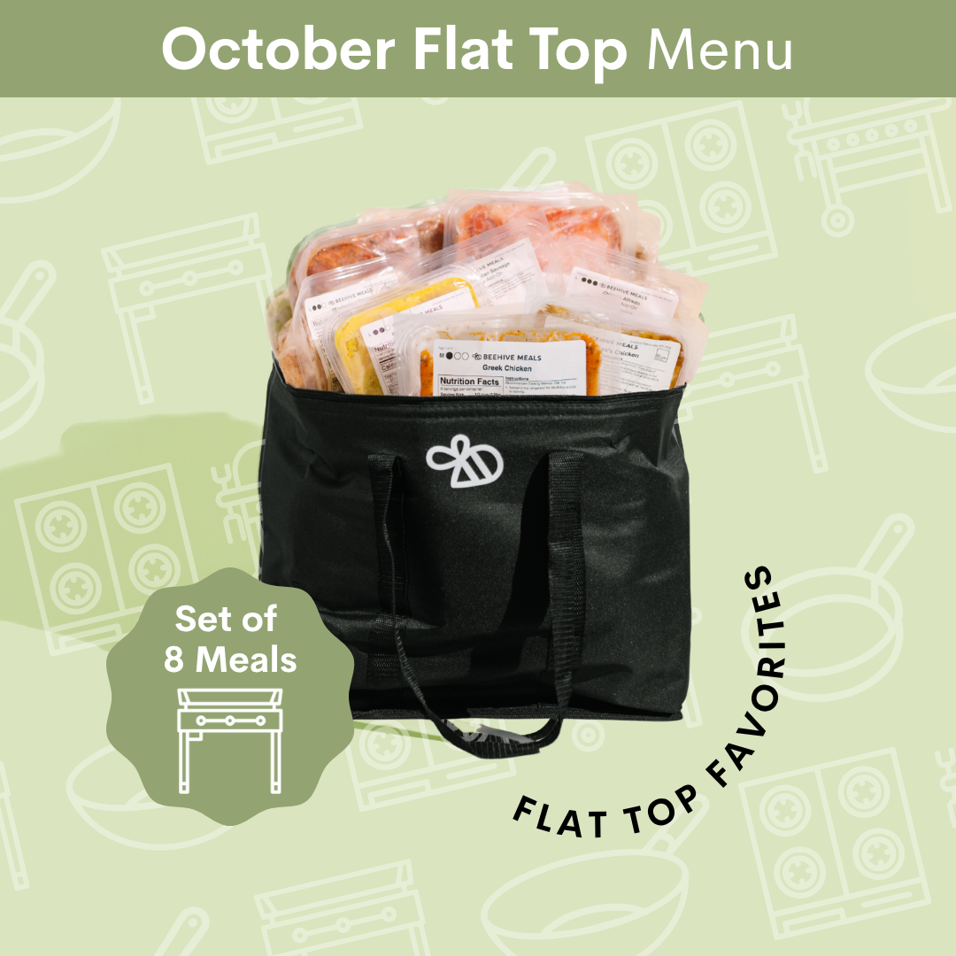 A black insulated flat-top bag filled with packaged meals, shown on a light green illustrated background with the text 'October Flat Top Menu' and 'Set of 8 Meals'.