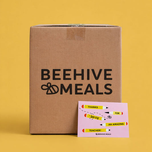 Cardboard box with 'Beehive Meals' branding on a yellow background