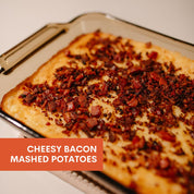Cheesy bacon mashed potatoes on a baking tray with text overlay.
