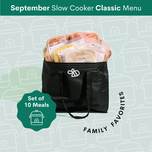 A black insulated slow cooker bag filled with packaged meals and food items, shown on a pale green patterned background with the text 'September Slow Cooker Classic Menu' and 'Set of 10 Meals Family Favorites'.