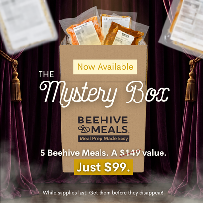 A cardboard box labeled 'BEEHIVE MEALS' with 'Now Available' and 'Just $99.' on a promotional graphic, surrounded by dark purple curtains and floating meal packages.
