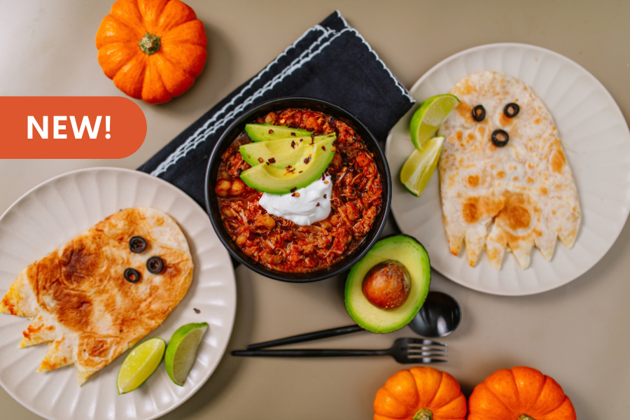 Image of Beehive Meals Pork Pozole Soup with quesadillas that are shaped to look like ghosts on the side. And text on the image saying 'new'.